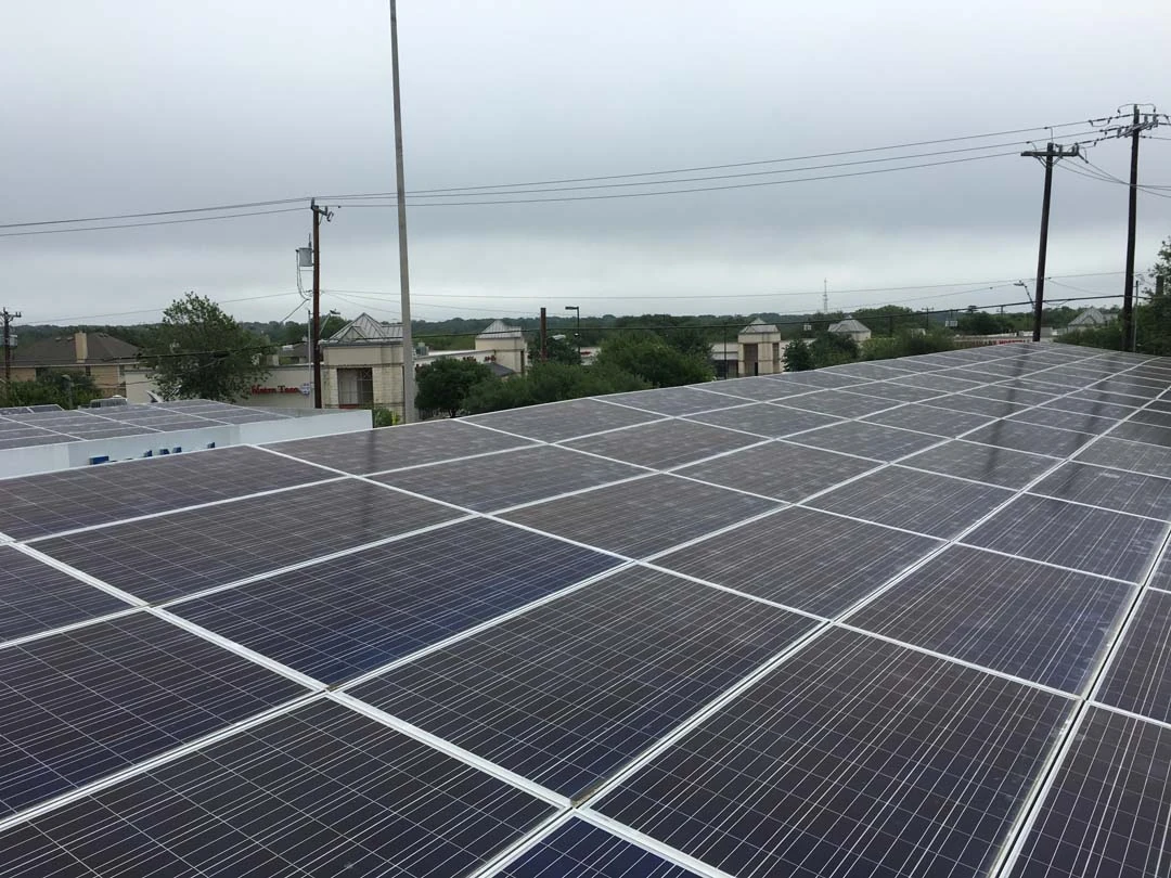 A commercial flat-roof solar array installed by Advanced Solar